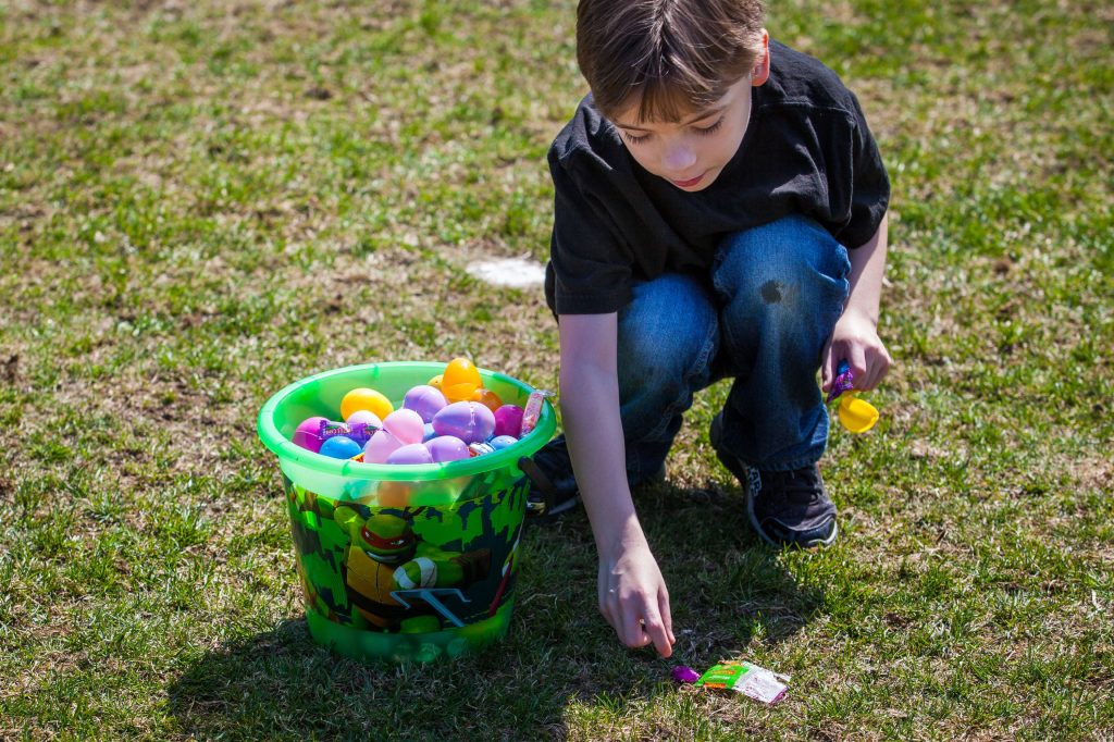 Stephen Jenkerson-Corliss, 7, of Concord picks up candy that fell from his bucket during an Easter egg hunt hosted by the Concord Grange at Keach Park in Concord on Saturday, April 15, 2017. Participation was broken into four age groups from two to 10 years old. (ELIZABETH FRANTZ / Monitor staff) Elizabeth Frantz