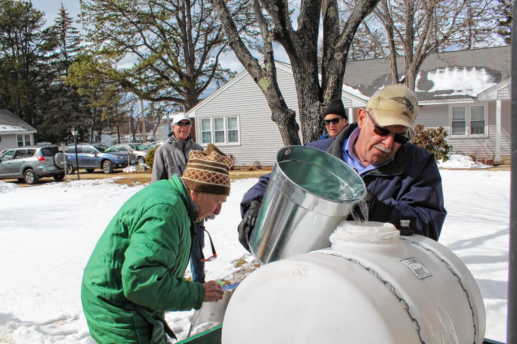 Ken Henderson adds sap to the collection tank during last week's roundup of buckets at Havenwood. Courtesy