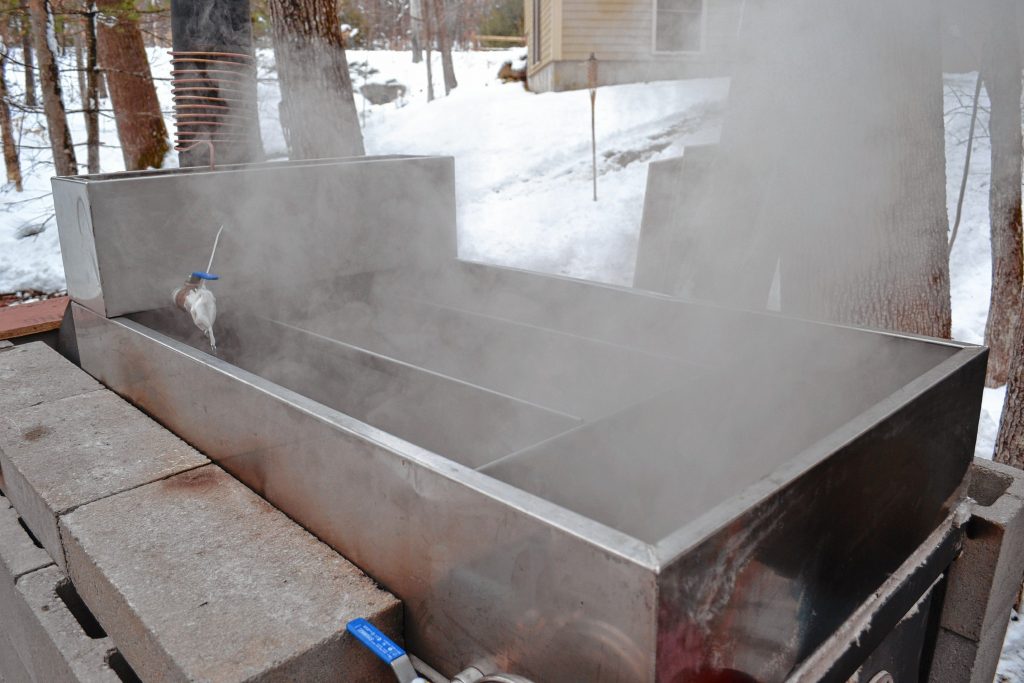 Steam rises off the outdoor evaporator at Beaver Brook Maple. TIM GOODWIN / Insider staff