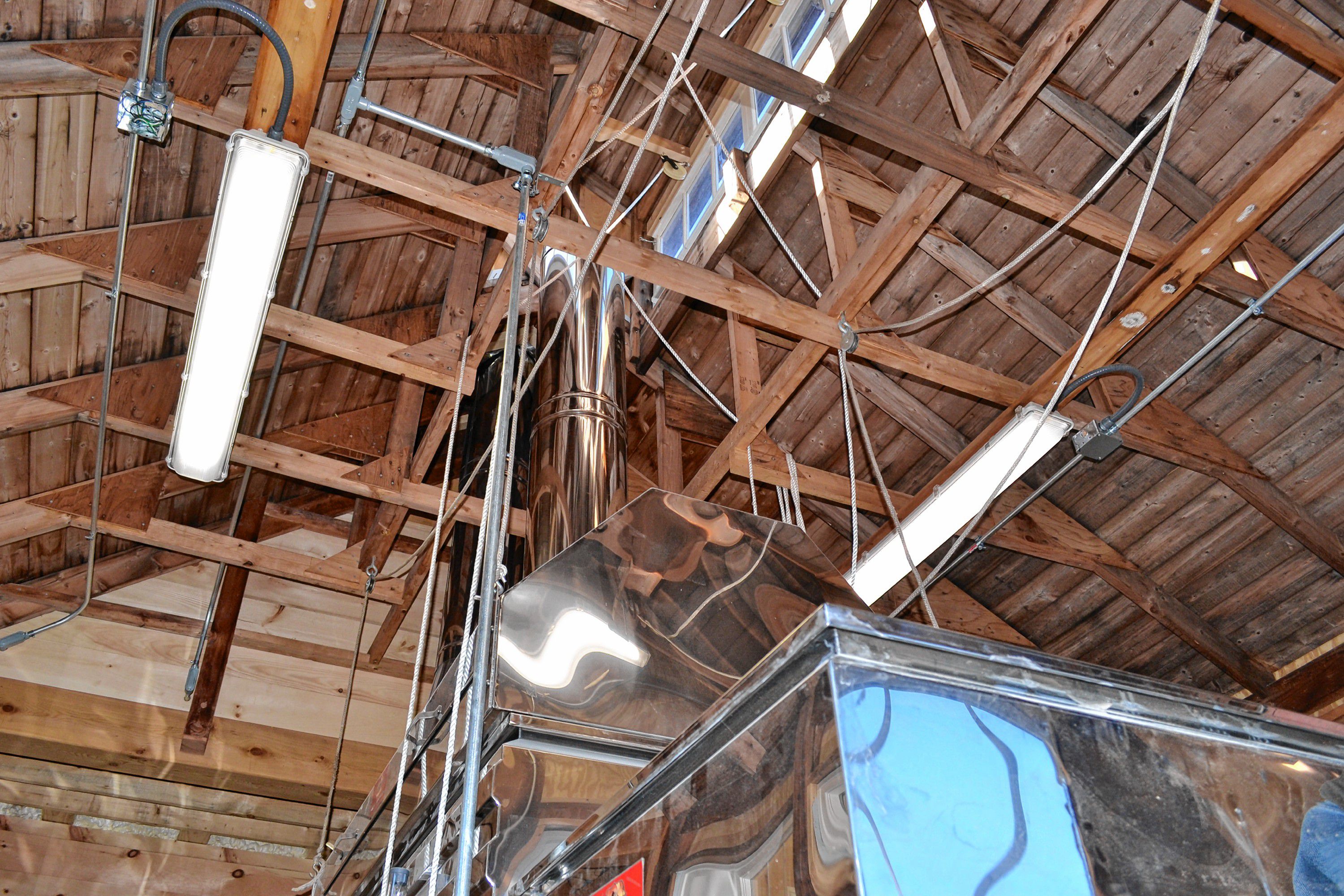 The new cupola in Mapletree Farm's new sugarhouse features windows from