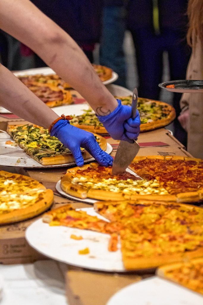 Chiefs Place serves slices during the Pizza Pie Showdown at the Holiday Inn in downtown Concord on Pi Day, Mar. 14, 2018. Proceeds from the event, hosted by the Concord Monitor and Insider, went to support the Friendly Kitchen. (ELIZABETH FRANTZ / Monitor staff) Elizabeth Frantz