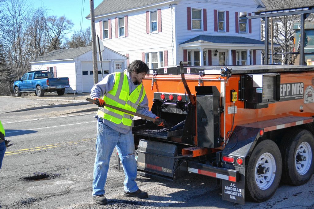 Tim filled some potholes with the Concord General Services crew last week at one of the busier spots in town – the intersection of Pleasant, Warren and North and South Fruit streets. Because it is spring in New Hampshire, and those potholes aren't going to fix themselves. KEVIN DEMERS / For the Insider