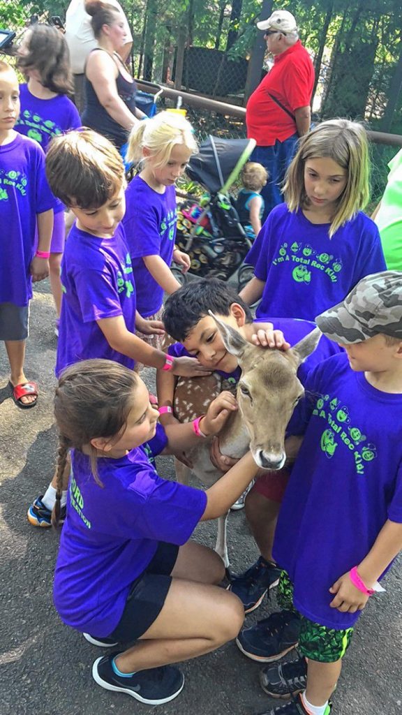 Campers from Concord Parks and Recreation's Rec Camp from last year (now known as Stay and Play Camp) get up close and personal with an adorable baby deer. Courtesy of Concord Parks and Recreation