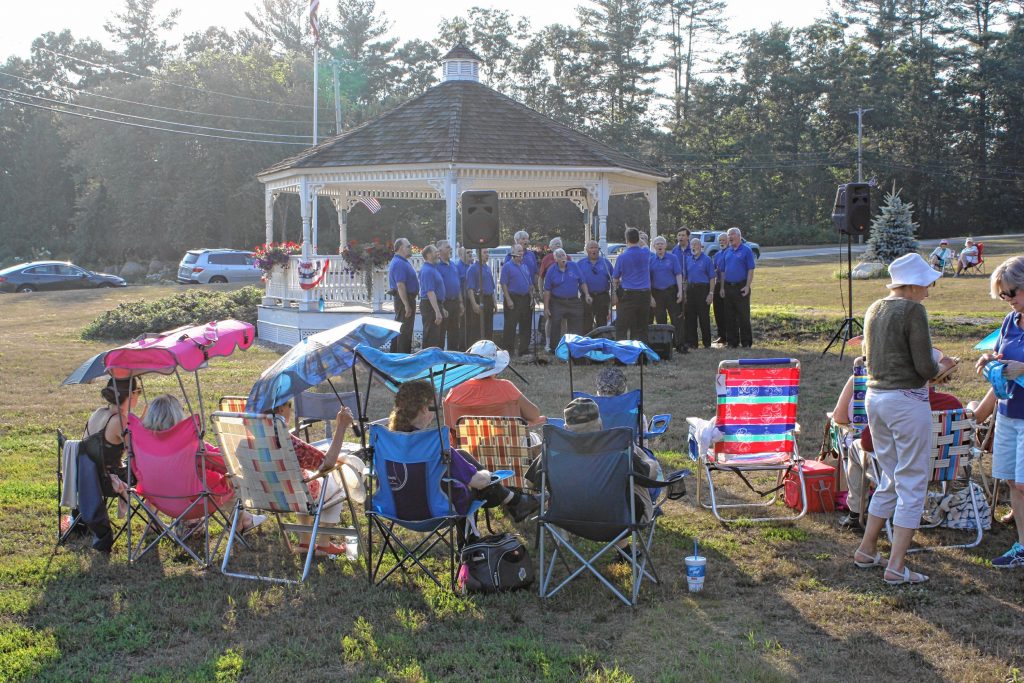 The Lakes Region Chordsmen sing for a big crowd at the town gazebo in Bow last Sunday evening.  JON BODELL / Insider staff