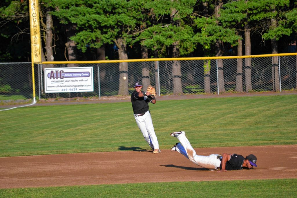 New Hampshire Wild shortstop Anthony Shkrelja makes a nice cross-diamond throw during a game against the Aguada Explorers at Memorial Field in Concord last Wednesday. TIM GOODWIN / Insider staff