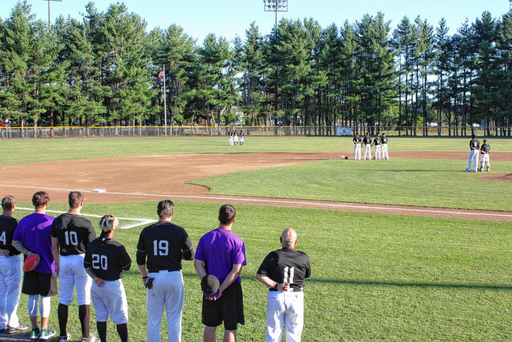 Members of the New Hampshire Wild stand for the national anthem before the start of their game at Memorial Field last Wednesday. JON BODELL / Insider staff