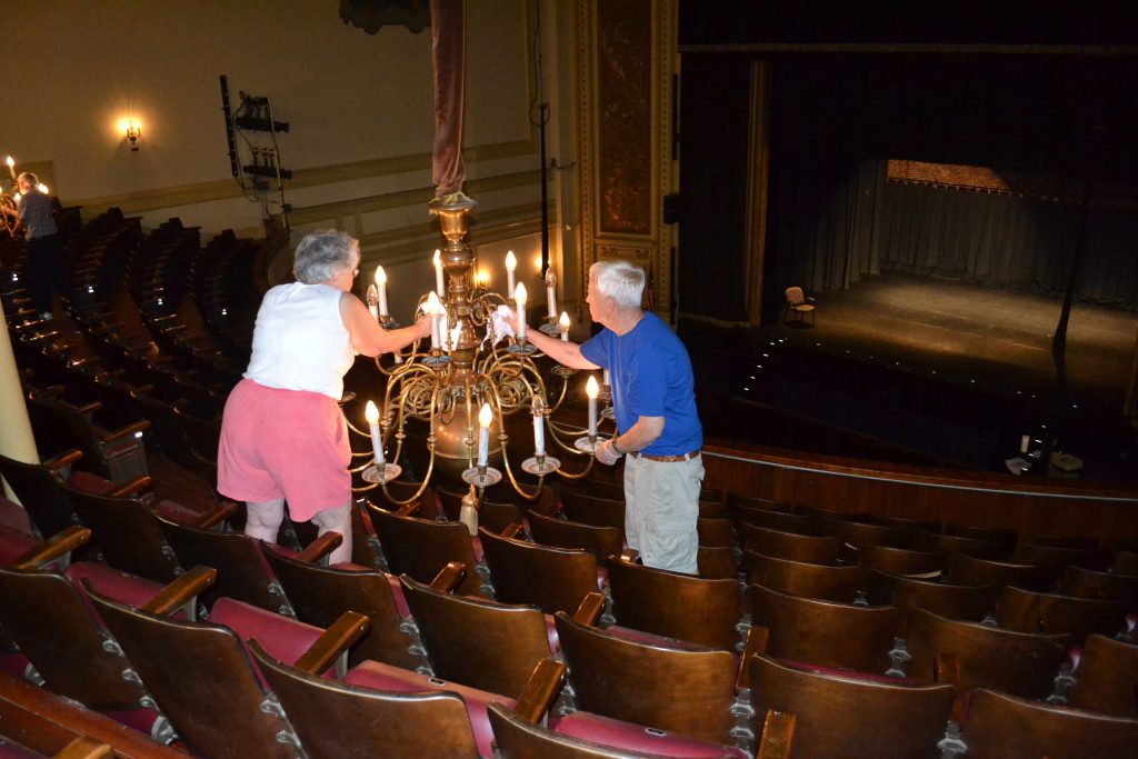 Joanna Otis and Joe Hayden polish a chandelier during the final day of the Friends of the Audi Pitch In last week. TIM GOODWIN / Insider staff