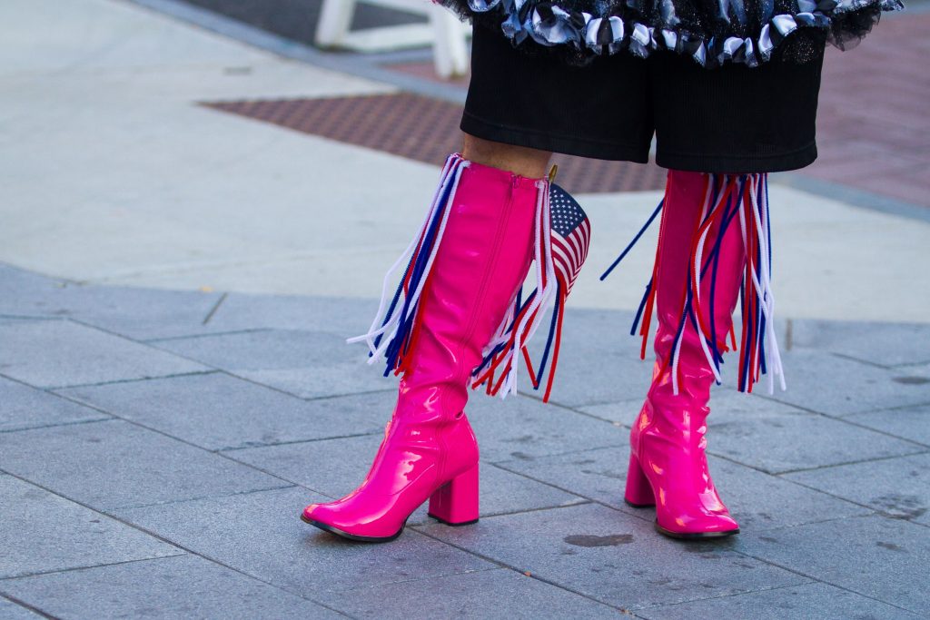 Grappone Auto team member Adam Memmolo of Warner wears a pair of pink boots decorated with an American flag during Walk a Mile in Her Shoes in downtown Concord on Wednesday, Oct. 4, 2017. (ELIZABETH FRANTZ / Monitor staff) Elizabeth Frantz