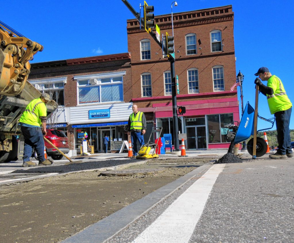 Concord general services workers patch a N. Main and Pleasant Street crosswalk on October 16, 2018. The crosswalk is one of four that needs to be repaired due to drainage issues. Caitlin Andrews