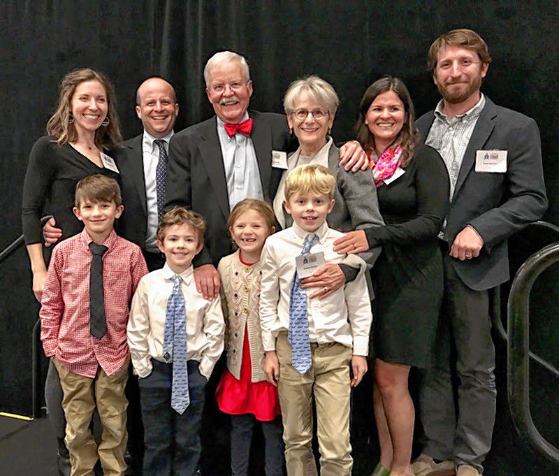 Greater Concord Chamber of Commerce 2018 Citizen of the Year David Ruedig stands with his family at the Chamber's 99th Annual Meeting/Citizen of the Year Award dinner on Nov. 7, 2018. Ruedig (center) is flanked by (from left) daughter-in-law Reagan, son Adam, wife Mary, daughter Laura, son-in-law Peter and his grandchildren (from left) Jack, Tom, Quinn and Charlie. Courtesy of Greater Concord Chamber of Commerce
