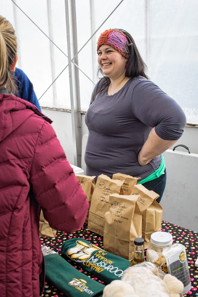 Stephanie Doyle, 31, of Tamworth sells gourmet mushrooms at the New Hampshire Mushroom Company stand at the Winter Farmers Market at Cole Gardens in Concord on Saturday, Mar. 17, 2018. (ELIZABETH FRANTZ / Monitor staff) Elizabeth Frantz
