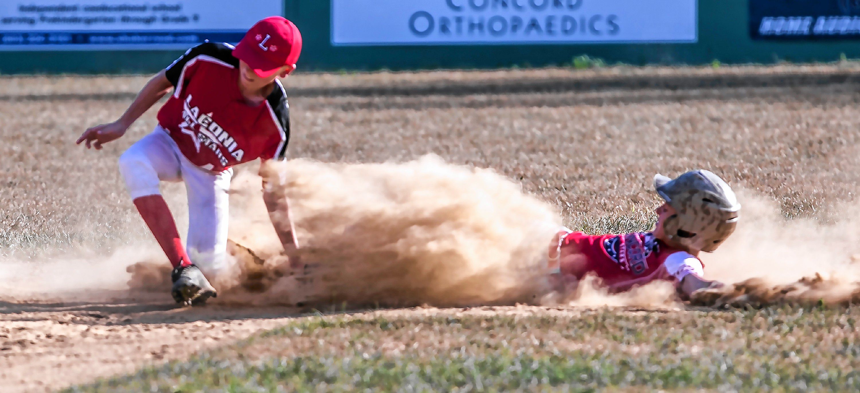 Concord Little League AllStar Nick Reynolds slides in safely as