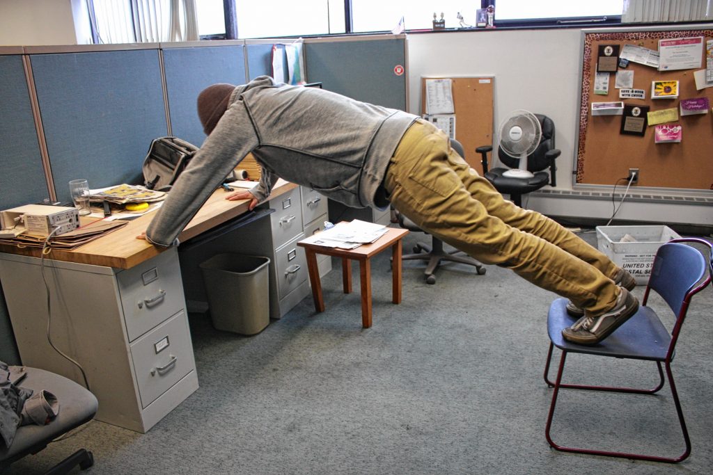 Don't be lazy at work -- do like I do and squeeze in some chair-and-desk pushups between conference calls. SARAH PEARSON / For the Insider