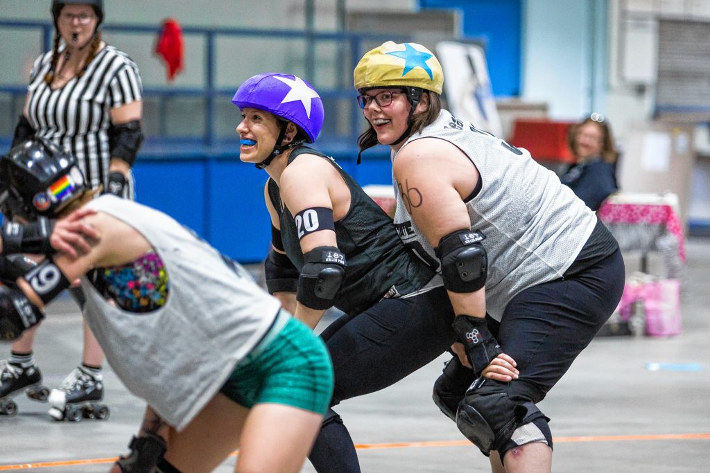 Critical Hit (20) and Fearliss (36) joke around during a break in a bout with participants from the Granite State Roller Derby clinic at Everett Arena in Concord on Saturday, May 19, 2018. Elizabeth Frantz
