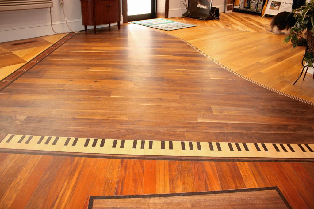 Olde Tyme Craftsmen sells and installs high-end wood floors, stairs and railings. From custom shapes cut into the floor using exotic woods to traditional prefinished hardwood, if you can walk on it, Olde Tyme Craftsmen  can make and install it. JON BODELL / Insider staff