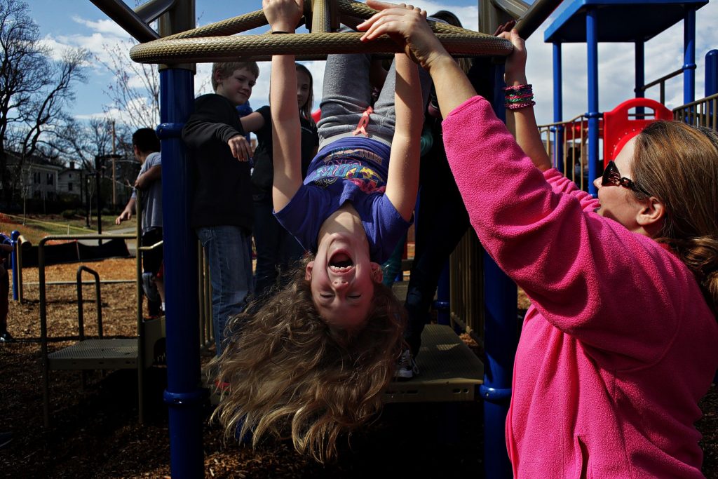 Camryn Champagne laughs while hanging out on the playground at the Christa McAuliffe School on Thursday, May 1, 2014 during the after school program. Concord School District, the Concord Family YMCA and the Boys and Girls Clubs of Greater Concord will expand after school programming in the 2014-15 year. The after school programs are currently operating at two of the city's five elementary schools. Next year, they will expand to include all five schools.  (ANDREA MORALES / Monitor staff) Camryn Champagne laughs while hanging out on the playground at Christa McAuliffe School on Thursday during the after-school program. The Concord Family YMCA and the Boys & Girls Clubs of Greater Concord will expand programming at Concord schools next year. Andrea Morales