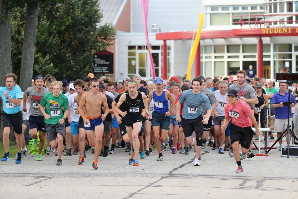 Runners bolt off the starting line at the 2017 Friendly Kitchen 5K on the NHTI campus in Concord. Courtesy of Hogan Camps / NHTI