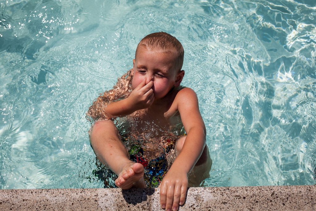 Five-year-old Jason Doucette of Concord takes a deep breathe before pushing off the edge of the Concord city pool in White Park on Tuesday, August 1, 2017. (ELIZABETH FRANTZ / Monitor staff) ELIZABETH FRANTZ
