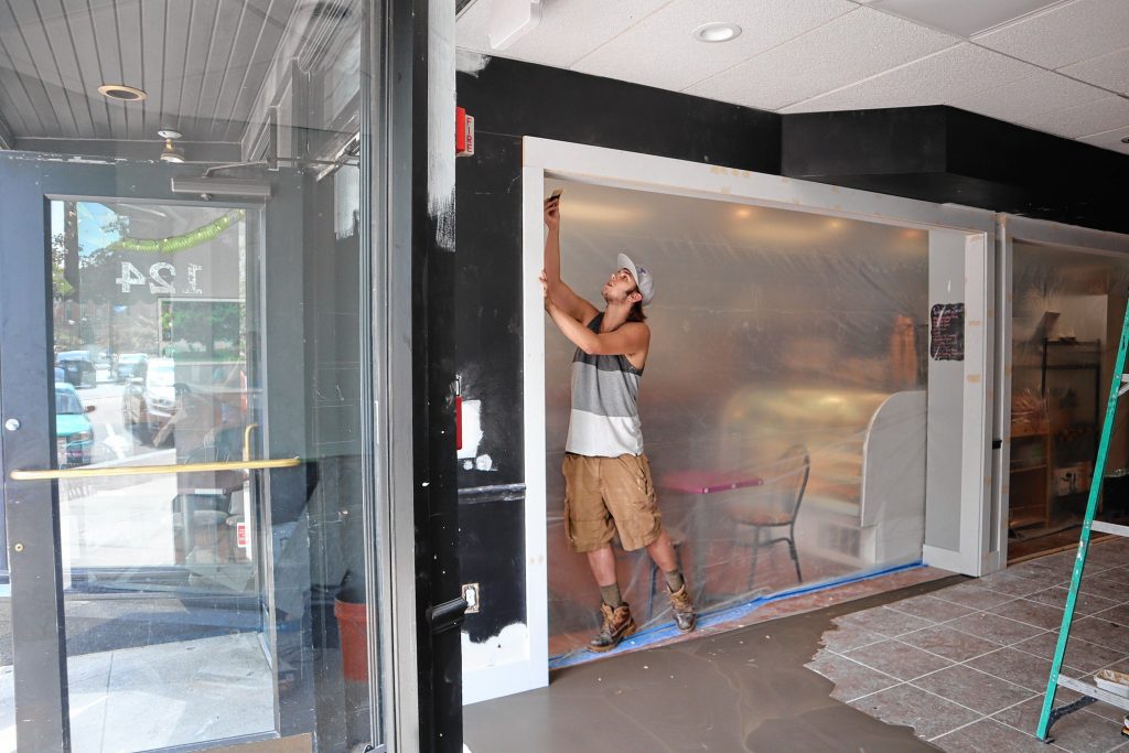 Cherry Blossom Renovation employee Dustin Bousquet works on  The Crust and Crumb Baking Co.’s expansion project.