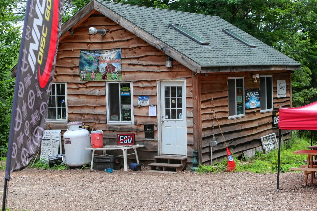 Pictured is the pro shop at Top O’ The Hill Disc Golf Course in Canterbury, where players can rent equipment, check out the course rules or just drop some money in the box and get started.