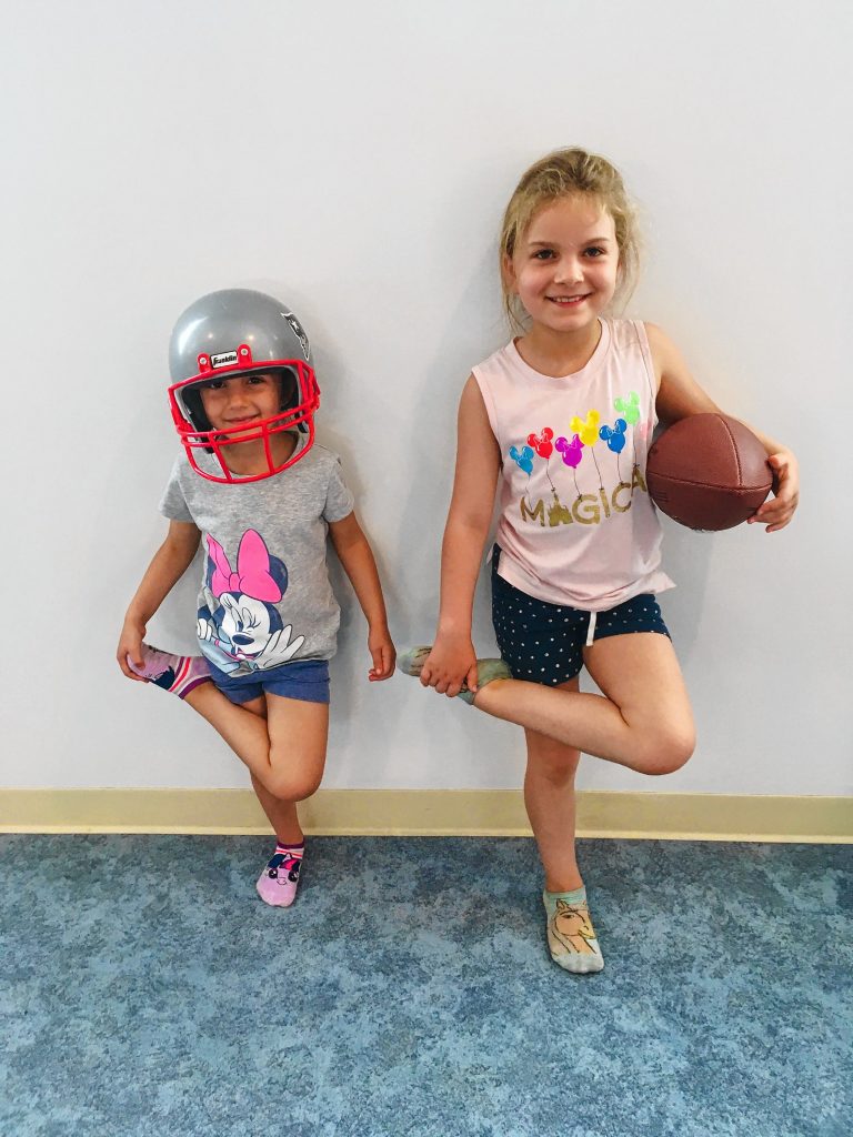 If there's one absolute fact in life, it's that you can't win six Super Bowl rings without practicing a little yoga, as Mike Morris's daughters are demonstrating here.  Courtesy of Mike Morris
