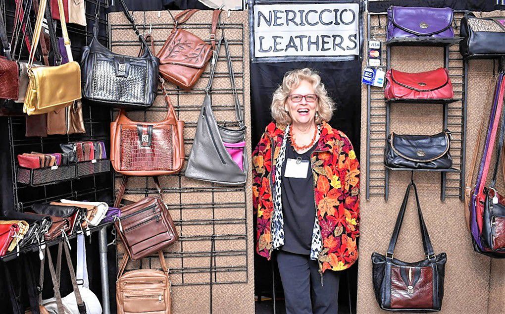 Diane Nericcio of Thorton poses with her handmade leather bags at the 2018 Capital Arts Fest in downtown Concord. This year's festival will run Sept. 27-29 on South Main Street in front of the League of N.H. Craftsmen headquarters.  Courtesy of League of N.H. Craftsmen