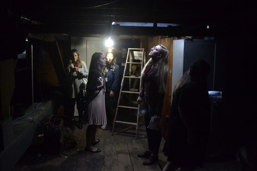 Members of the yellow group check out the attic at Parker Academy on Oct. 4, 2018, during the Upstairs Downtown tour.  The building was the home of Lewis Downing Jr. and staff of the school say the attic light turns on without cause.  Sarah Pearson