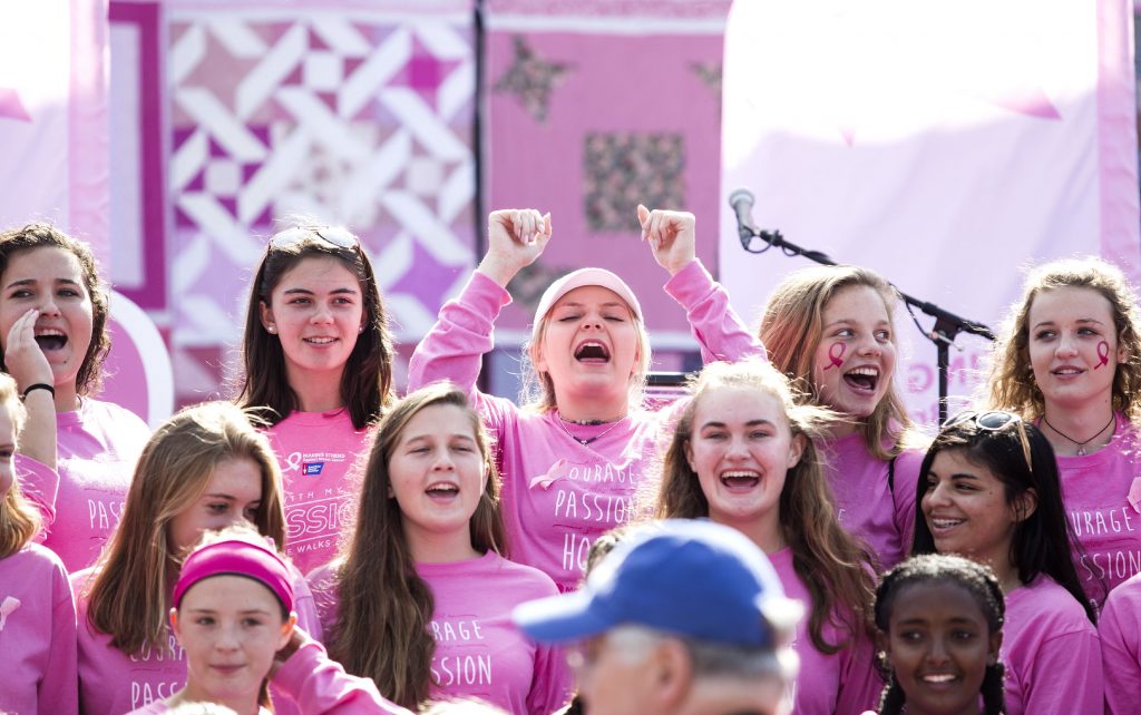 Coe Brown Northwood soccer captain Kiley St. Francis (center with arms raised) leads her team as Michael St Germain of Concord Photo Service gets ready to take the Making Strides Against Breast Cancer team photo on Sunday October 15, 2017 at Memorial field. GEOFF FORESTER