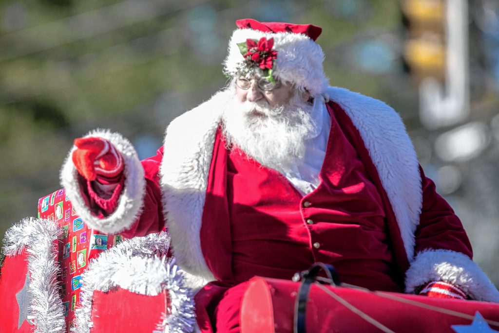 Santa Claus waves to the crowd as the last float at the 68th annual Concord Grange 322 Christmas parade along Loudon Road on Saturday, November 23, 2019. GEOFF FORESTER