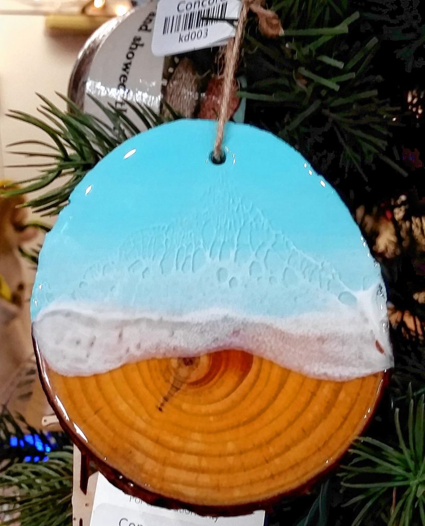 Can't afford a trip to the Bahamas this winter? Give a little ocean with a resin and wood ornament that looks like the sea.  Sarah Pearson