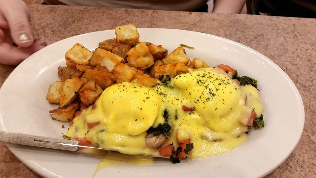 Eggs Benedict Florentine with home fries from the Post Downtown.  