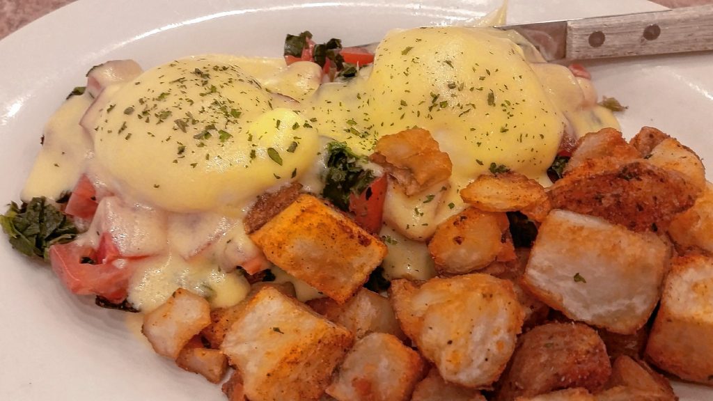 Eggs Benedict Florentine with home fries from the Post Downtown.  