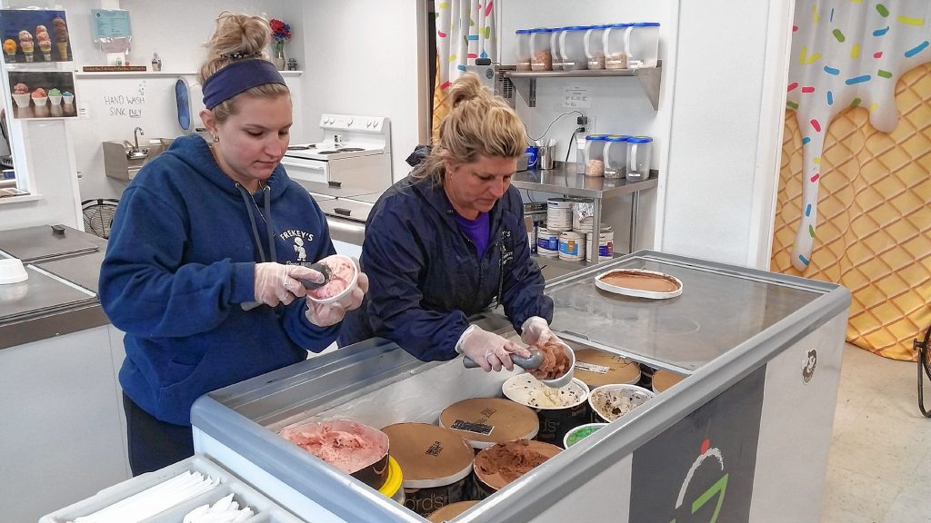Frekey's Dairy Freeze owner, Carol Frekey-Harkness (right), scoops an ice cream order with her daughter, Sarah Harkness, at their Concord location on May 14, 2019. 
