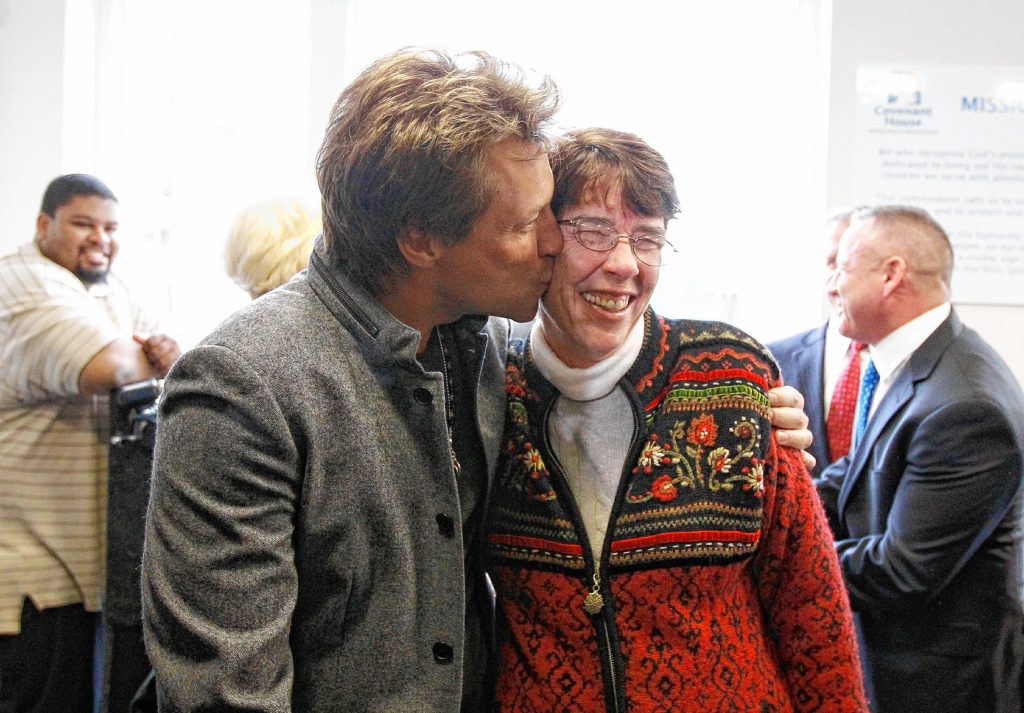 Recording artist Jon Bon Jovi  embraces Sister Mary Scullion during an event marking the opening of Covenant House's new facility Tuesday, April 19, 2011, in Philadelphia.  The Covenant House shelter in the city's Kensington neighborhood plans to house 20 formerly homeless people ages 18 to 21.(AP Photo/Matt Rourke) Matt Rourke