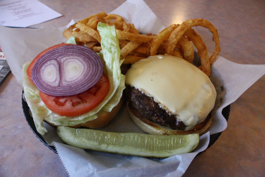 The Texas Burger from Makris Lobster & Steak House comes with lettuce, onion, tomato, mayonnaise (which I told them to hold in lieu of ketchup and mustard) and cheese. (JON BODELL / Insider staff) JON BODELL / Insider staff