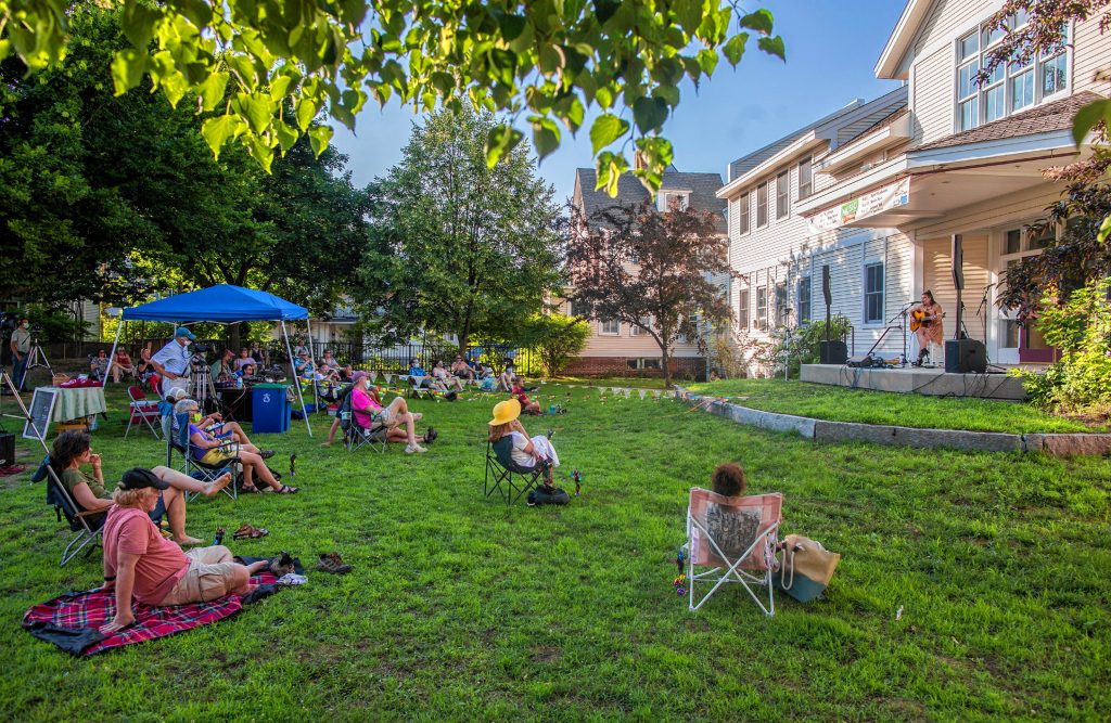 Patrons watch an outdoor concert from the Fletcher-Murphy Park organized by the Bank of N.H. Stage in July. A free concert will be held in the theatre to test protocols.