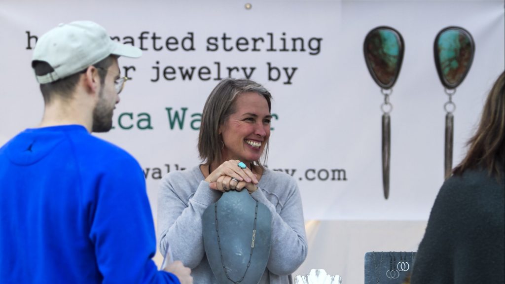 Erica Walker of North Sutton greets customers at her booth at the Capital Arts Fest in dowtown Concord on Friday, September 28, 2018.  GEOFF FORESTER