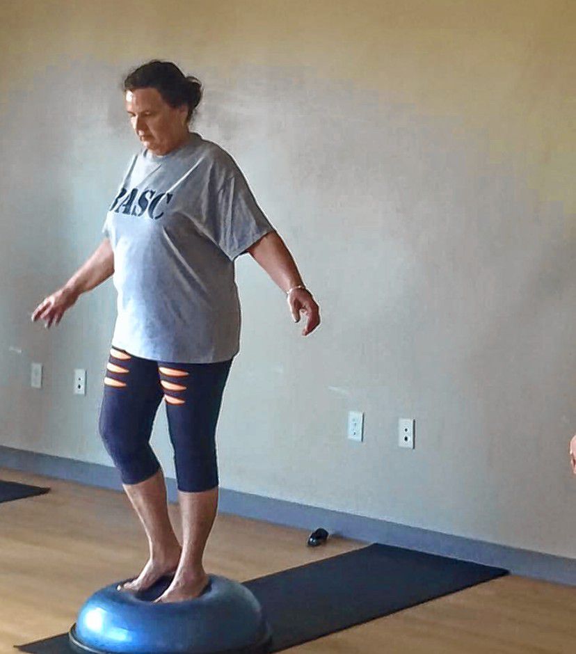 Donna Alosa works on her balance on a BOSU trainer. 