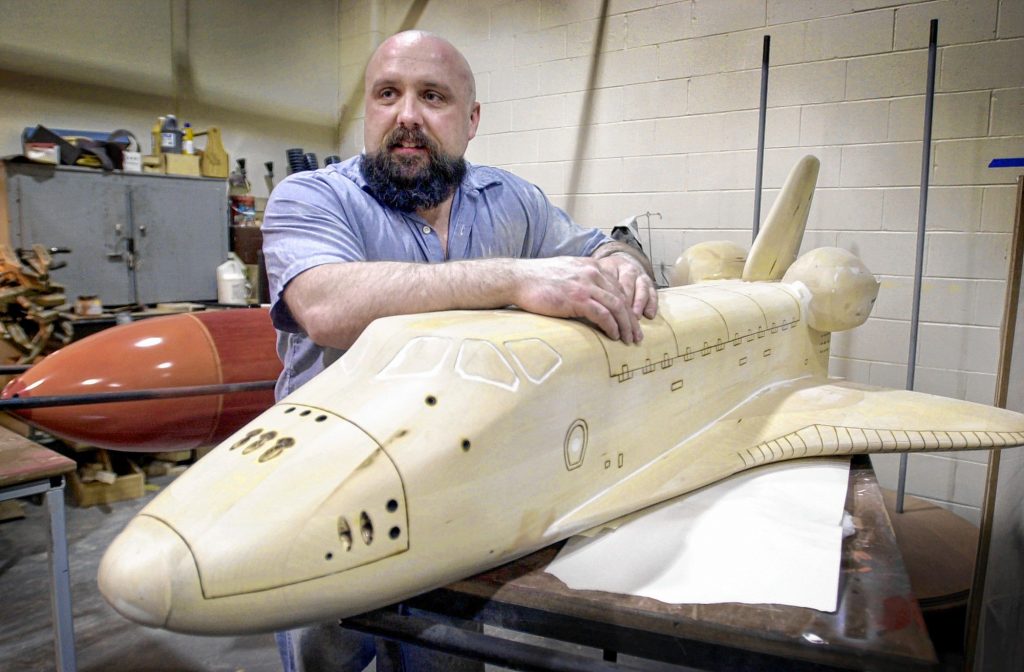 Maine State Prison inmate Rod Whitten takes a break while working on a new a model of the space shuttle Challenger in the prison woodworking shop on May 20, 2004 in Warren, Maine. Whitten's shuttle is to be placed on permanent display at the Christa McAuliffe Planetarium in Concord. AP