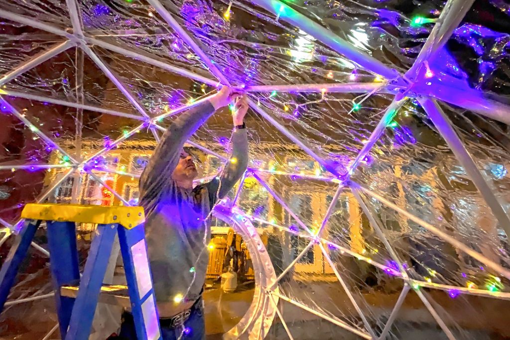 Cheers owner Todd Roy puts up lights into one of the four igloos he and his wife and co-owner, Wendy, are erecting for diners can eat outdoors on the restaurant patio on Monday, January 11, 2020. GEOFF FORESTER