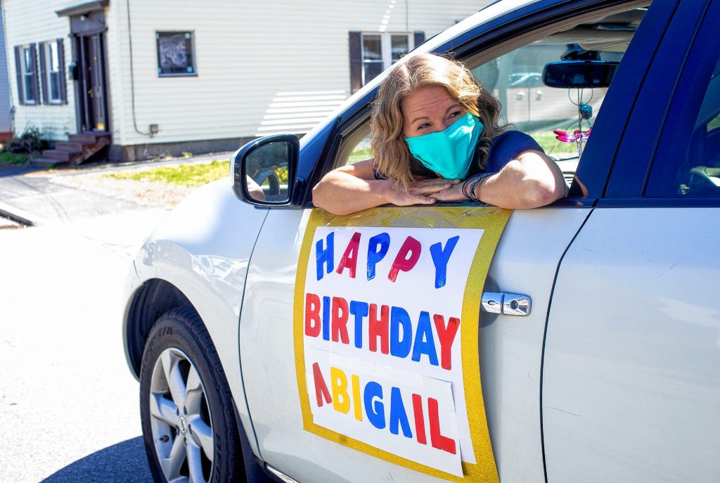 Candace Abood has her car adorned with signs and balloons for a drive-by birthday celebration on April 25, 2020.