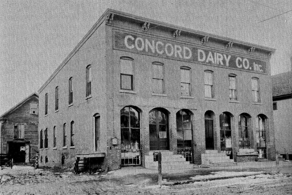 The Concord Dairy building pictured in 1921  was located on Washington Street in Concord, New Hampshire. Today the building location is a paved parking lot for UNH Law students. 