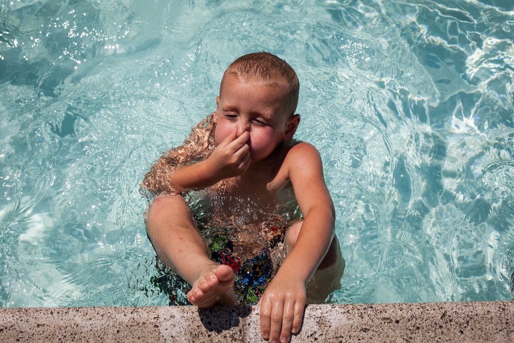 Five-year-old Jason Doucette of Concord takes a deep breathe before pushing off the edge of the Concord city pool in White Park on Tuesday, August 1, 2017. (ELIZABETH FRANTZ / Monitor staff) ELIZABETH FRANTZ