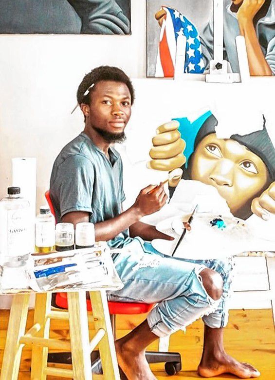 Jozimar Matimano, in his Manchester studio, initially developed his artistic skills in the Democratic Republic of the Congo before his family fled to a refugee camp in Uganda. He now studies art at the New England College. 