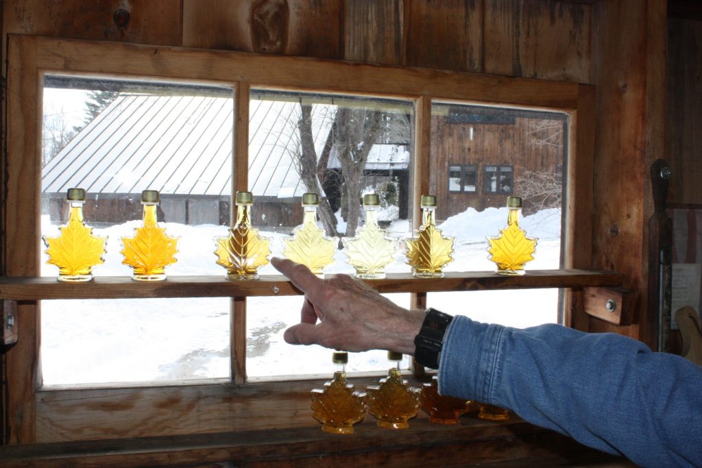 A seasoned maple syrup pro can tell a lot about the temperatures of a given season by looking at the color of the syrup. Darker syrup correlates to warmer temperatures, and vice versa. In this shot taken at Mapletree Farm in Concord, the first two bottles on the left are from this year -- one for each boil owner Dean Wilber has done so far. After those two, the rest are bottles from last year's season, in order. By looking at this photo, we can tell that last year started off a little warm (the first bottle sap is on the darker side), then it cooled off for a little while, which is why you see the very light colors in the middle. Then, at the end of the season when it was the warmest, the syrup was the darkest.  (JON BODELL / Insider staff) JON BODELL / Insider staff