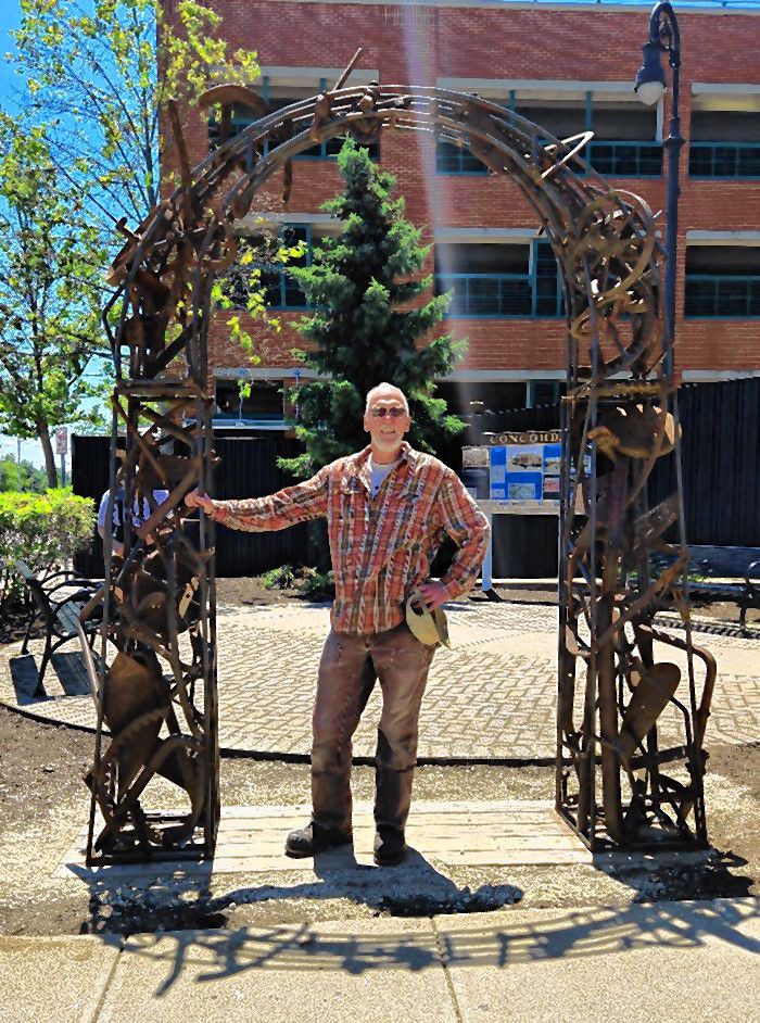 “Earth Arch” by Joe Chirchirillo is part of the Art on Main annual outdoor sculpture exhibit.