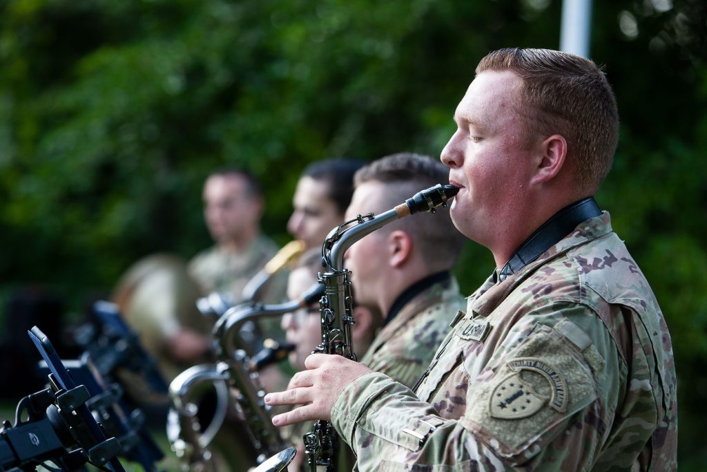 U.S. Army Specialist Scott Compton plays the sax for the 39th Army Band out of Manchester on Thursday, July 24, 2019 during a concert at the Pierce Manse on Penacook Street. 