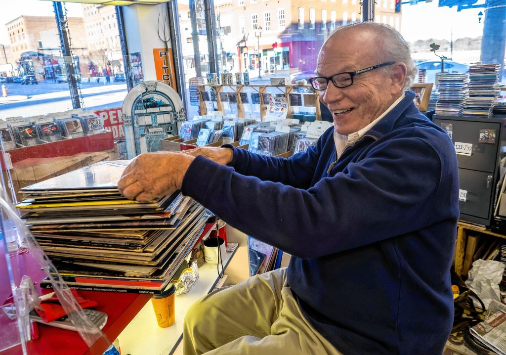 Pitchfork Records owner Michael Cohen sifts through albums to mark for pricing at the downtown store on Wednesday, November 9, 2022. GEOFF FORESTER
