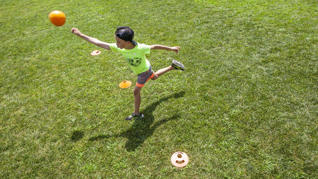 Leo McGinn tosses the ball during Jeti Dodgeball at the Concord Parks and Recreationâs Stay and Play Camp at Keach Park on Tuesday, July 26, 2022. The camps around the city will extended a week into August. 