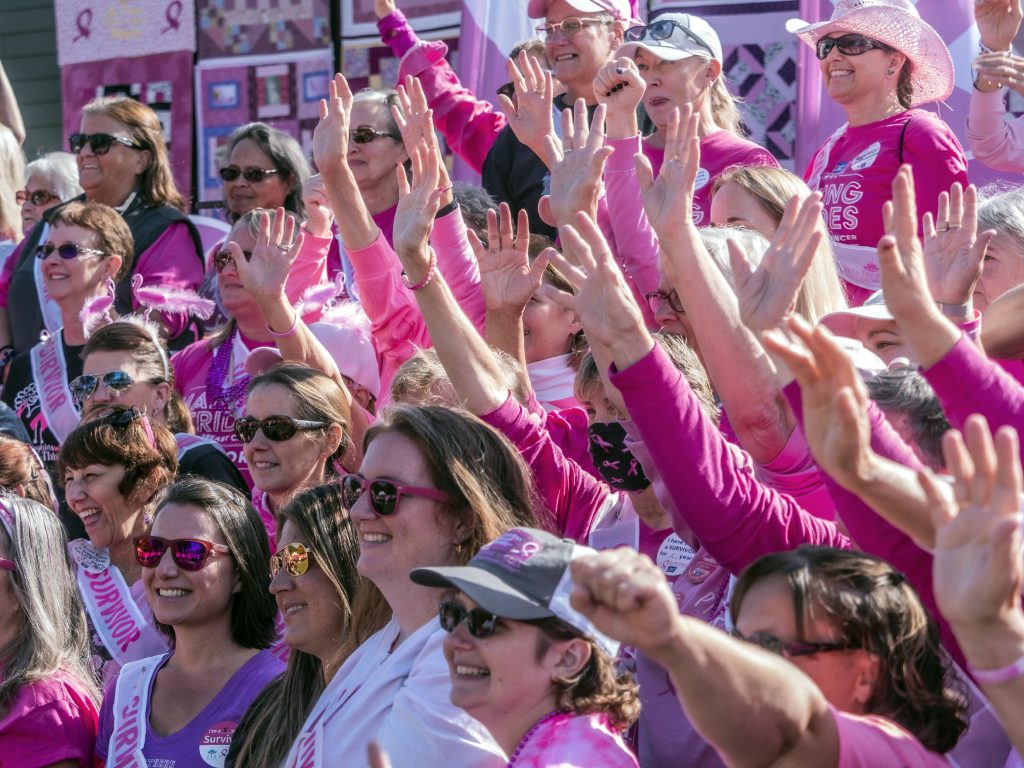 Breast Cancer survivors acknowledge the crowd up on the stage at the 30th annual Making Strides Against Breast Cancer Walk at Memorial Field on Sunday, October 15, 2022. 